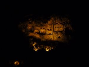 Tombs lit up at night across the river from us