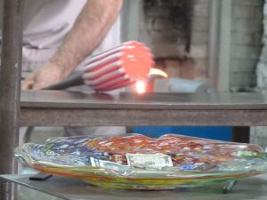 A glass vase being made