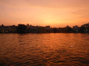 The sun setting over Lake Pichola